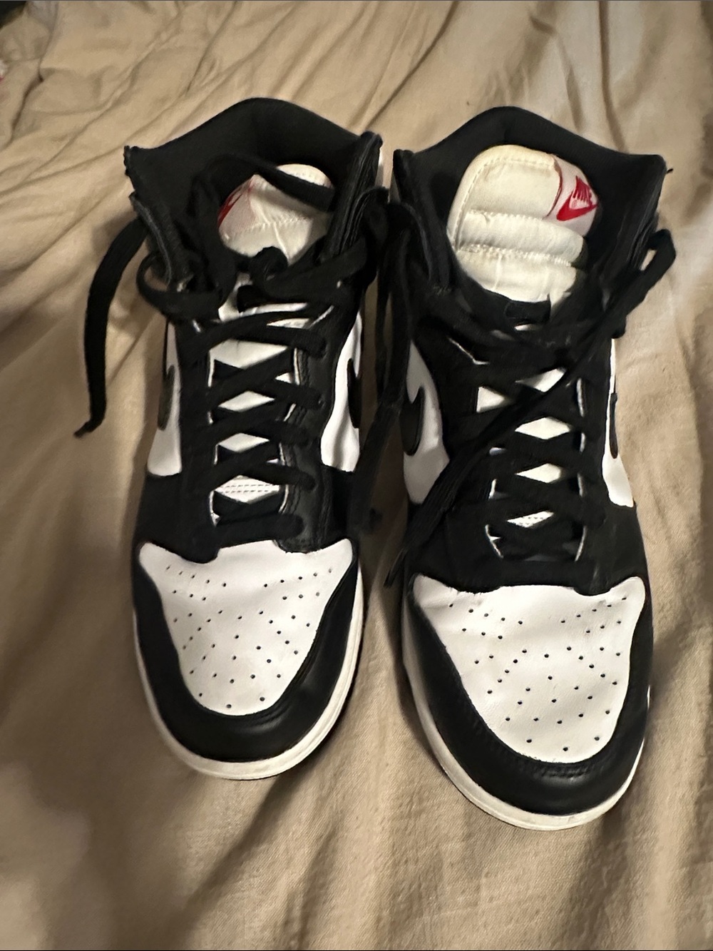Nike women’s Black and White High-Top Sneakers with Red Tongue Logo